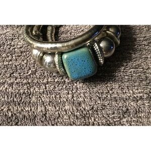 Silver bangle bracelet with blue stone with black flecks